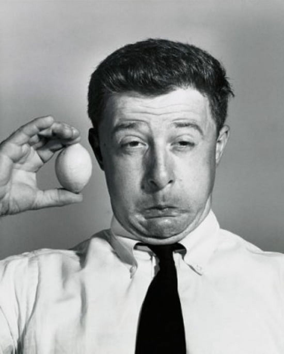 Close-up of a businessman holding a lemon and making a funny face Canvas Art - (24 x 36)