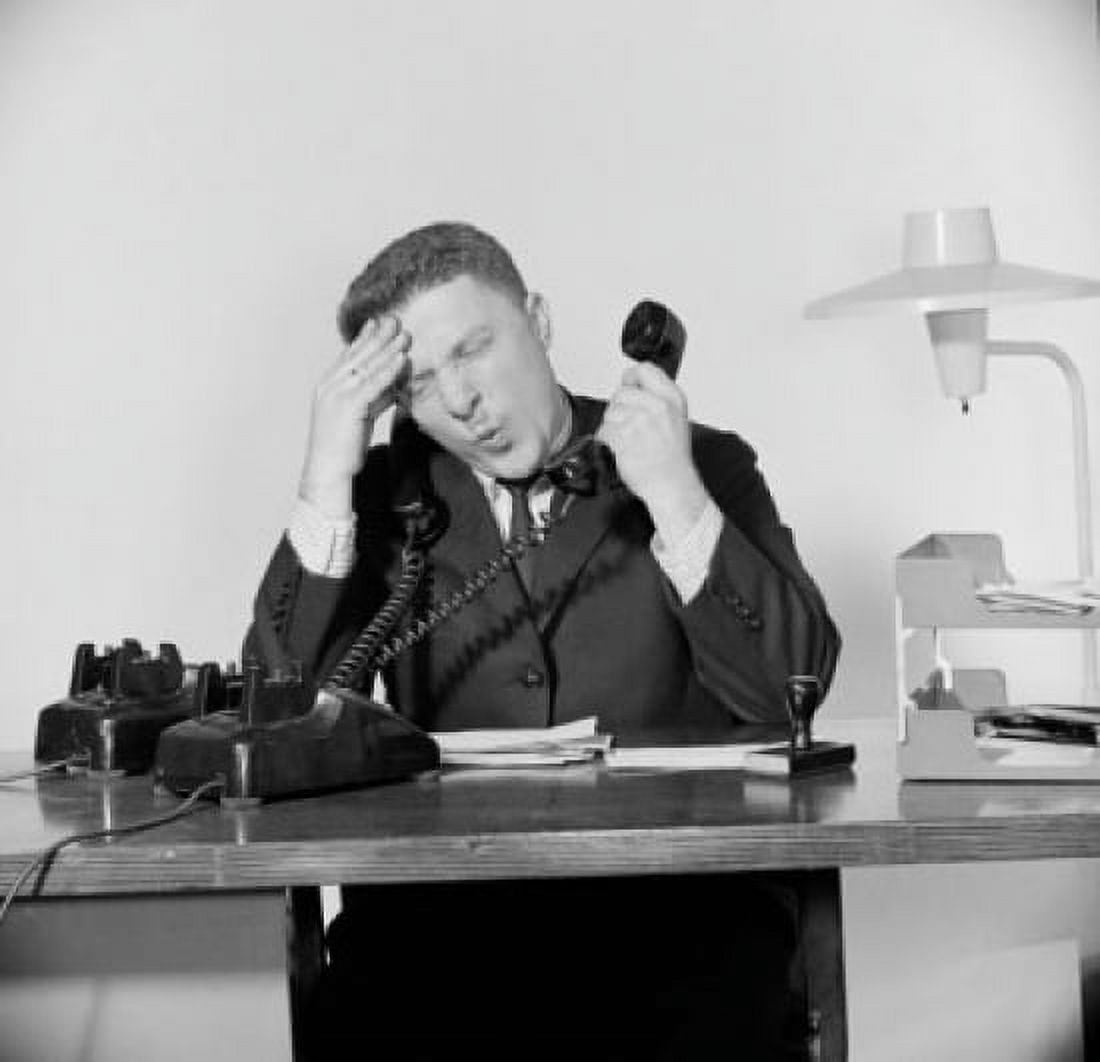 Close-up of a businessman suffering from a headache and using two telephones Canvas Art - (24 x 36)