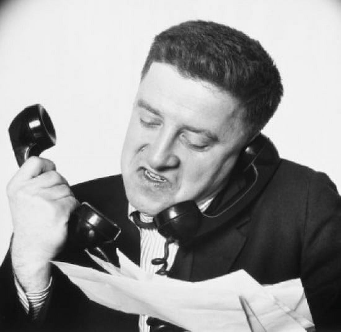 Close-up of a businessman using two telephones looking frustrated Canvas Art - (18 x 24)