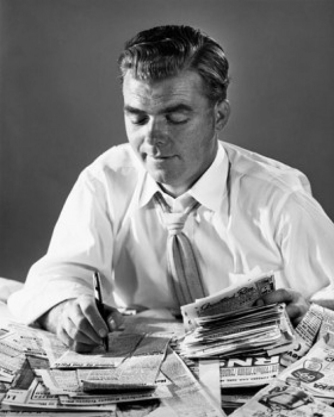 Close-up of a businessman writing on newspaper cuttings Canvas Art - (24 x 36)