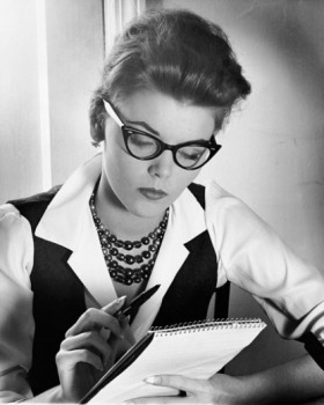 Close-up of a businesswoman holding a pen and a notepad Canvas Art - (24 x 36)