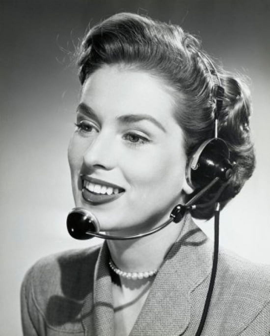 Close-up of a businesswoman wearing a headset and smiling 1952 Canvas Art -  (18 x 24)