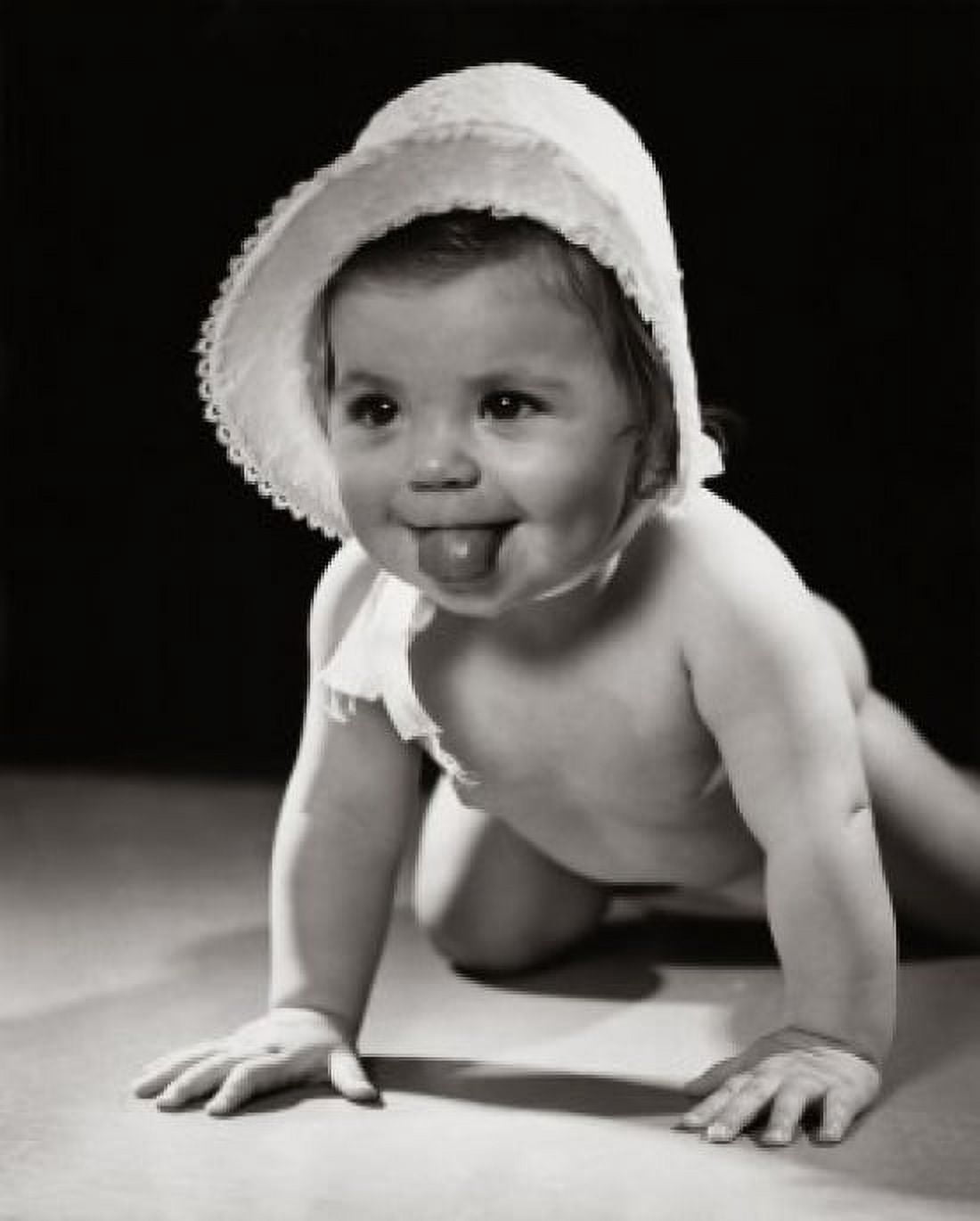 Close-up of a crawling baby sticking out its tongue Canvas Art - (18 x 24)
