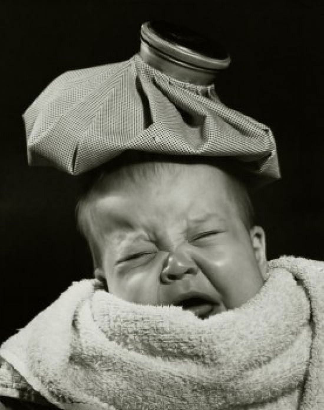 Close-up of a crying baby with an ice pack on his head Canvas Art - (18 x 24)