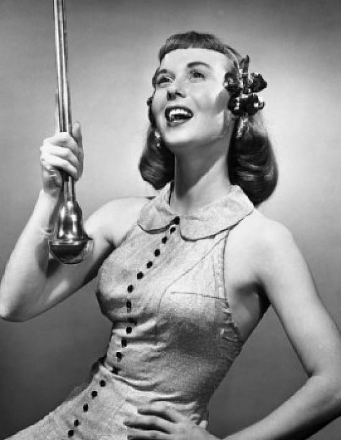 Close-up of a drum majorette performing with a twirling baton and smiling Canvas Art - (24 x 36)