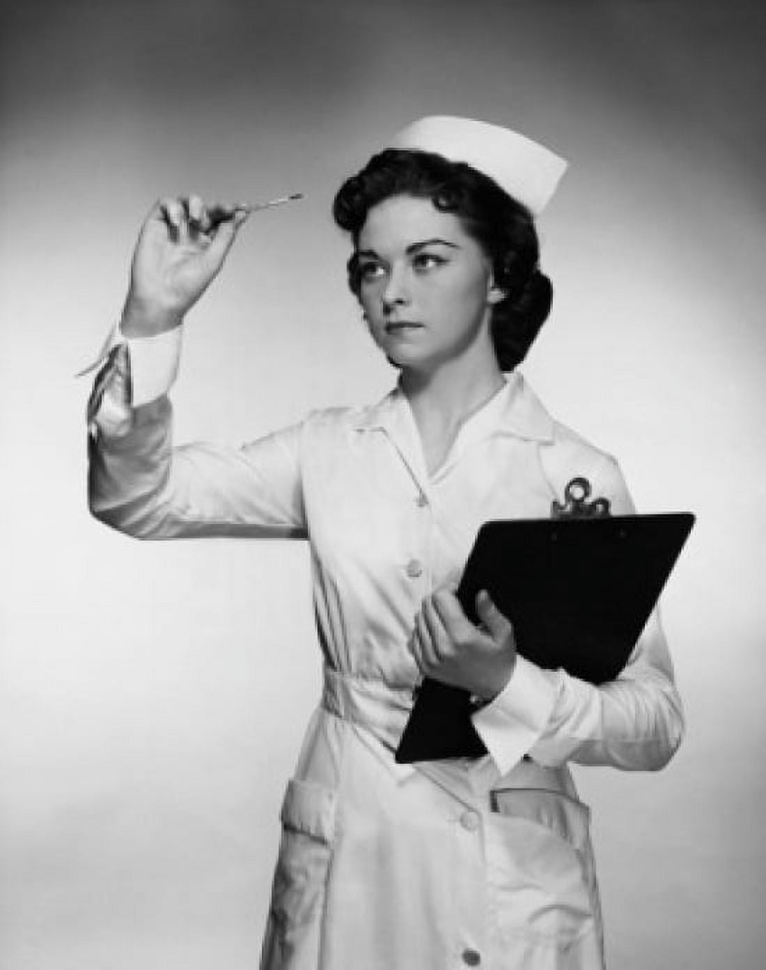Close-up of a female nurse reading a thermometer and holding a clipboard Canvas Art - (18 x 24)