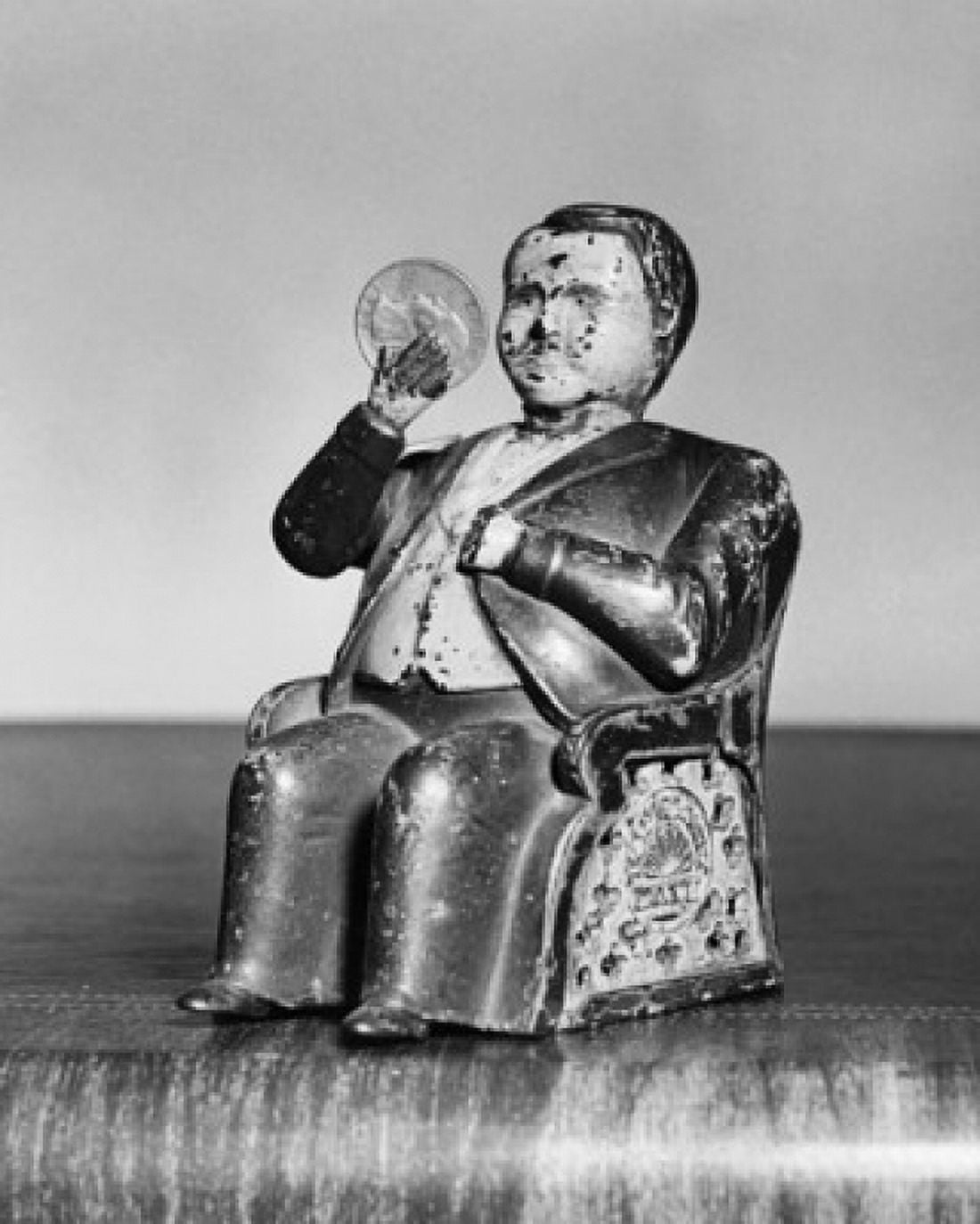 Close-up of a figurine with a coin Canvas Art - (18 x 24)