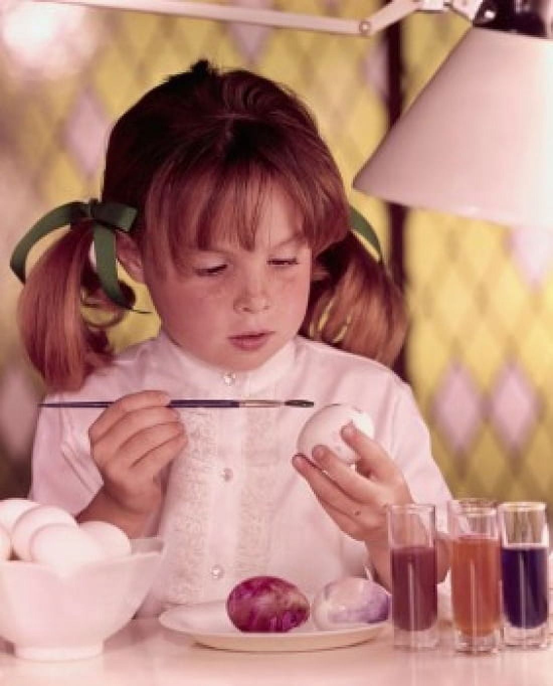 Close-up of a girl coloring eggs for Easter Canvas Art - (18 x 24)