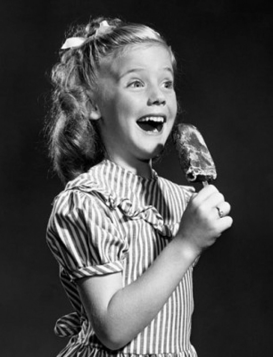 Close-up of a girl eating an ice cream Canvas Art - (24 x 36)