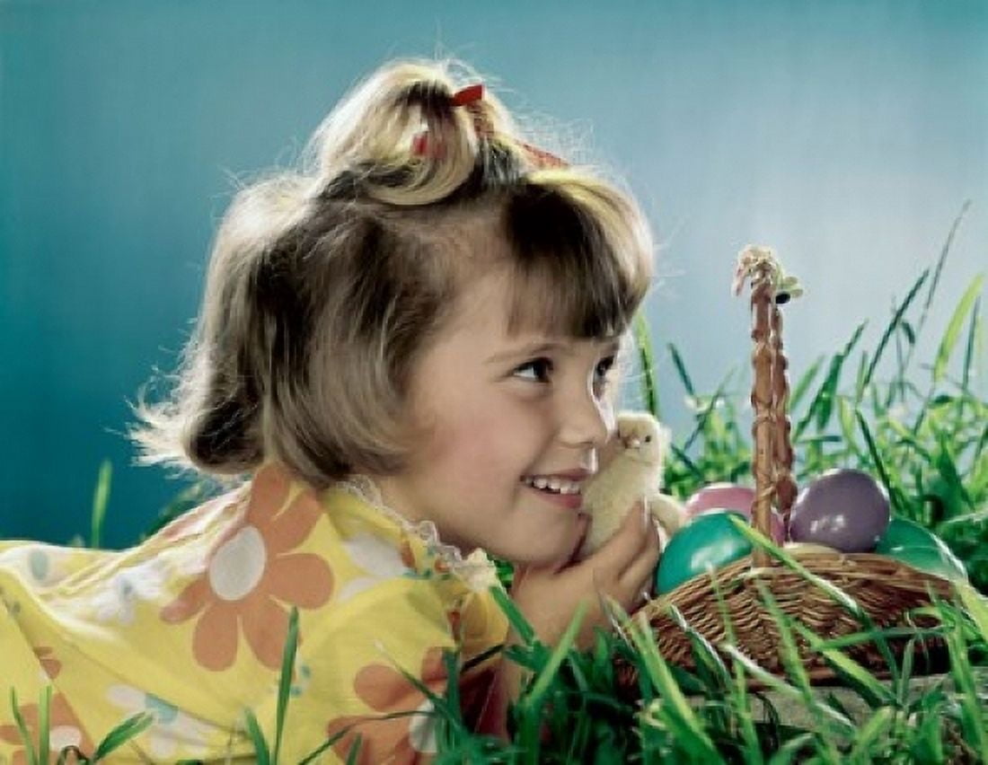 Close-up of a girl holding a chick and smiling Canvas Art - (24 x 36)