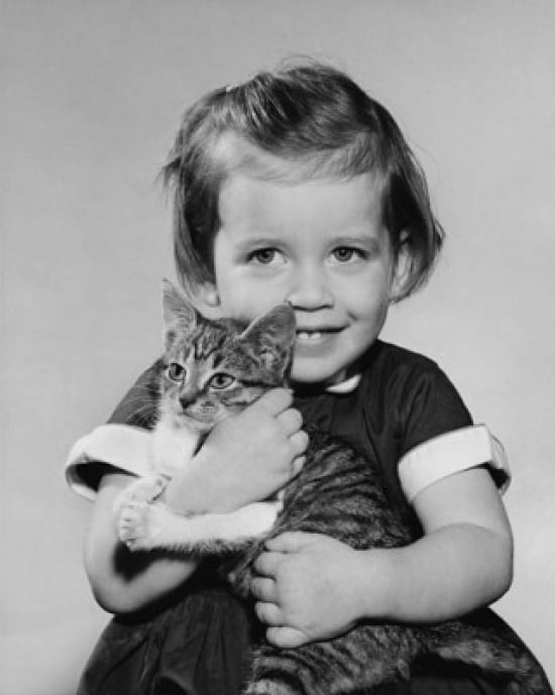 Close-up of a girl holding a kitten Canvas Art - (18 x 24)