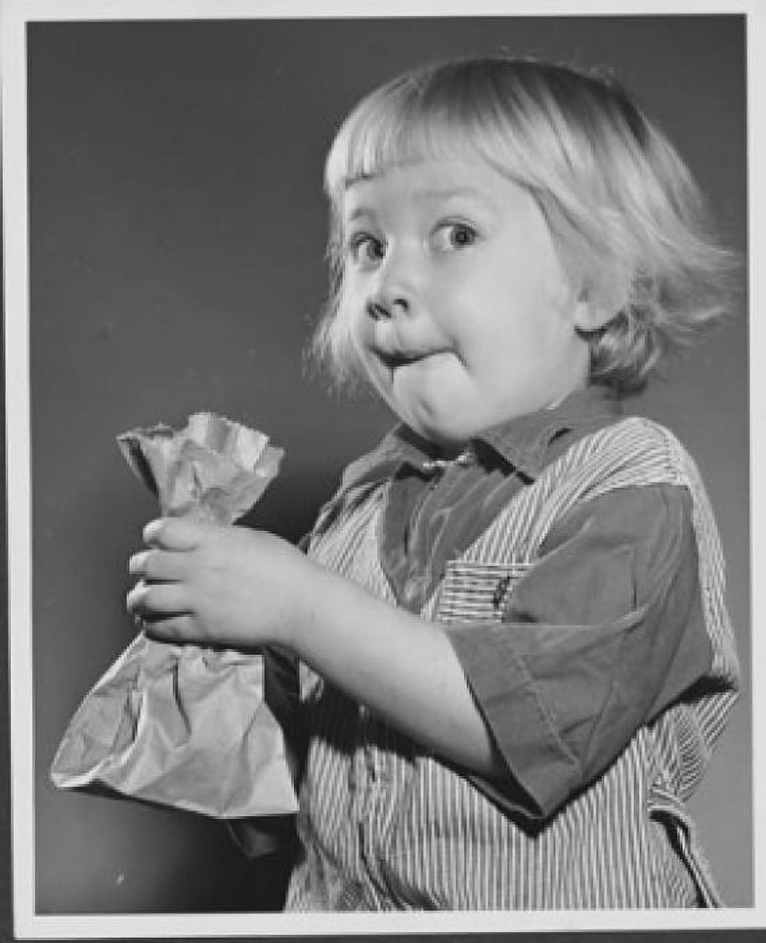 Close-up of a girl holding a paper bag Canvas Art - (24 x 36)