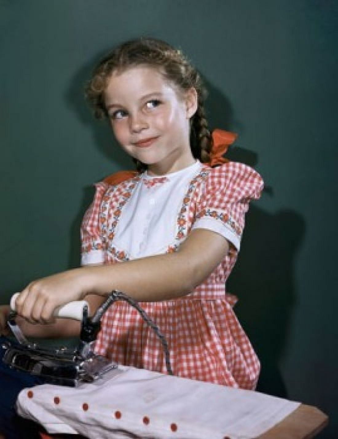 Close-up of a girl ironing clothes Canvas Art - (18 x 24)