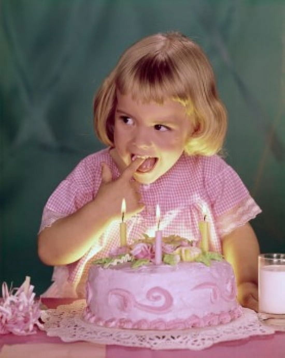 Close-up of a girl licking the icing of a birthday cake Canvas Art - (24 x 36)