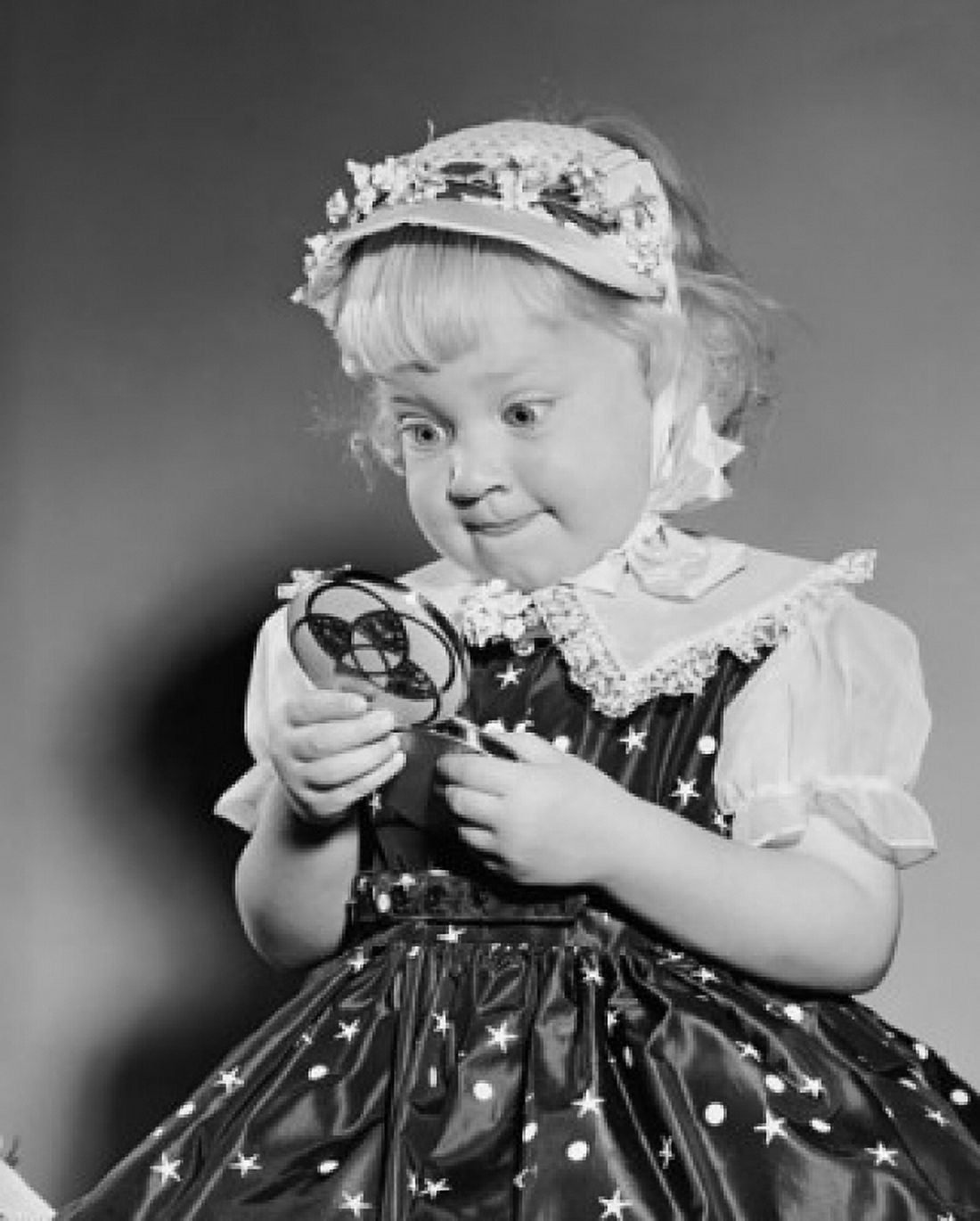 Close-up of a girl looking in a hand mirror Canvas Art - (18 x 24)