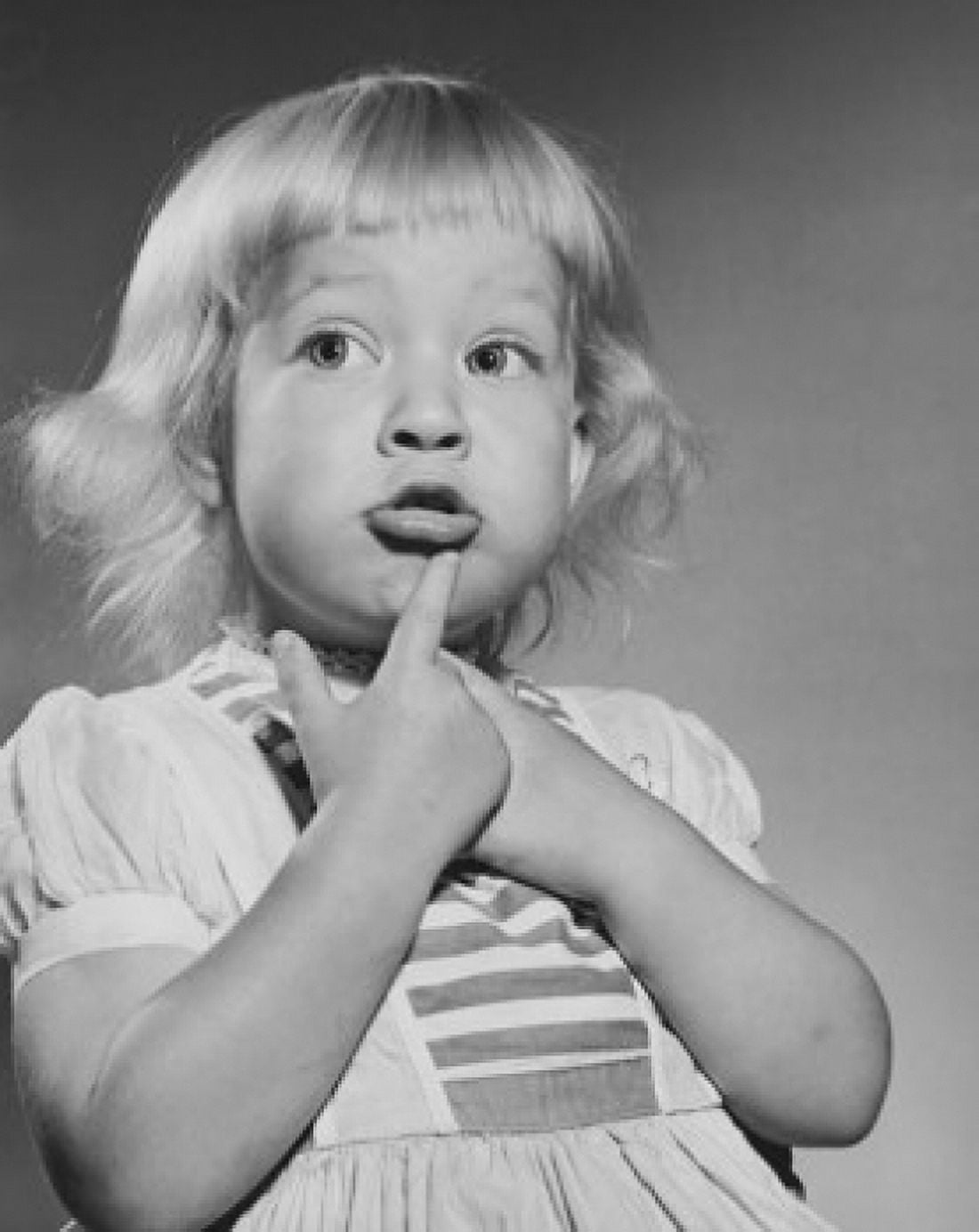 Close-up of a girl with her finger on her chin Canvas Art - (24 x 36)
