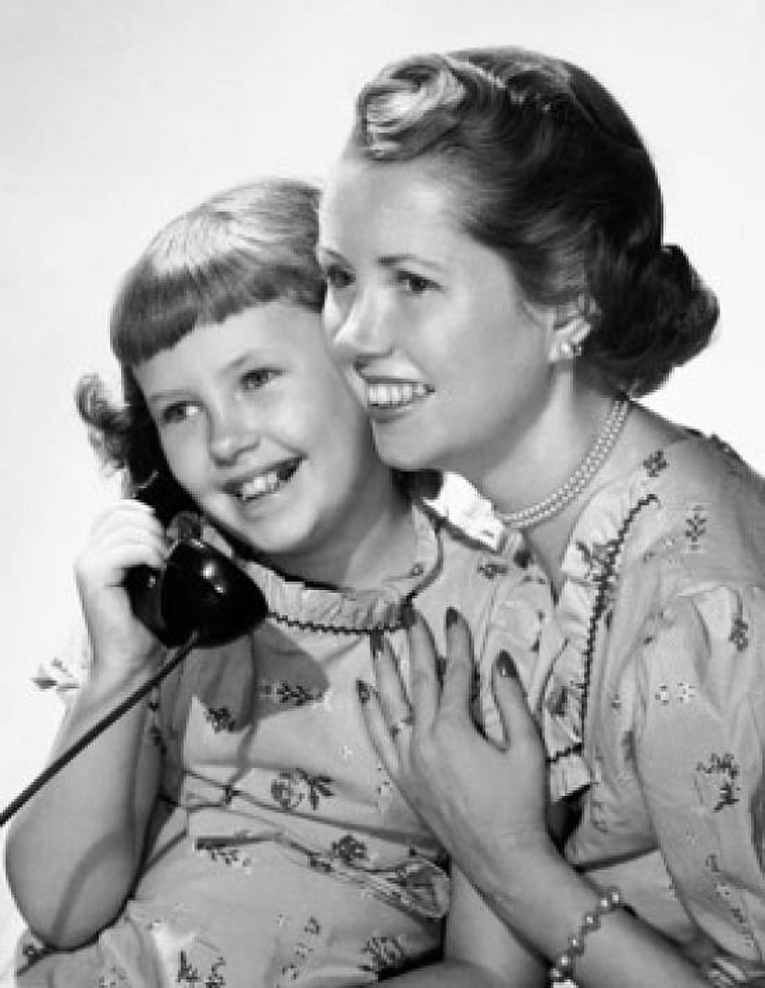 Close-up of a girl with her mother talking on the telephone Canvas Art - (24 x 36)