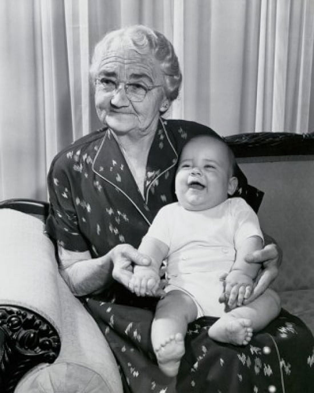 Close-up of a grandmother sitting on a couch with her grandson on her lap Canvas Art - (18 x 24)