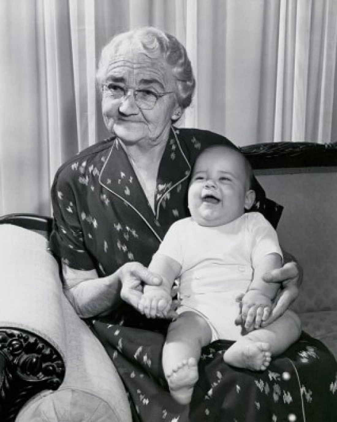 Close-up of a grandmother sitting on a couch with her grandson on her lap Canvas Art - (24 x 36)