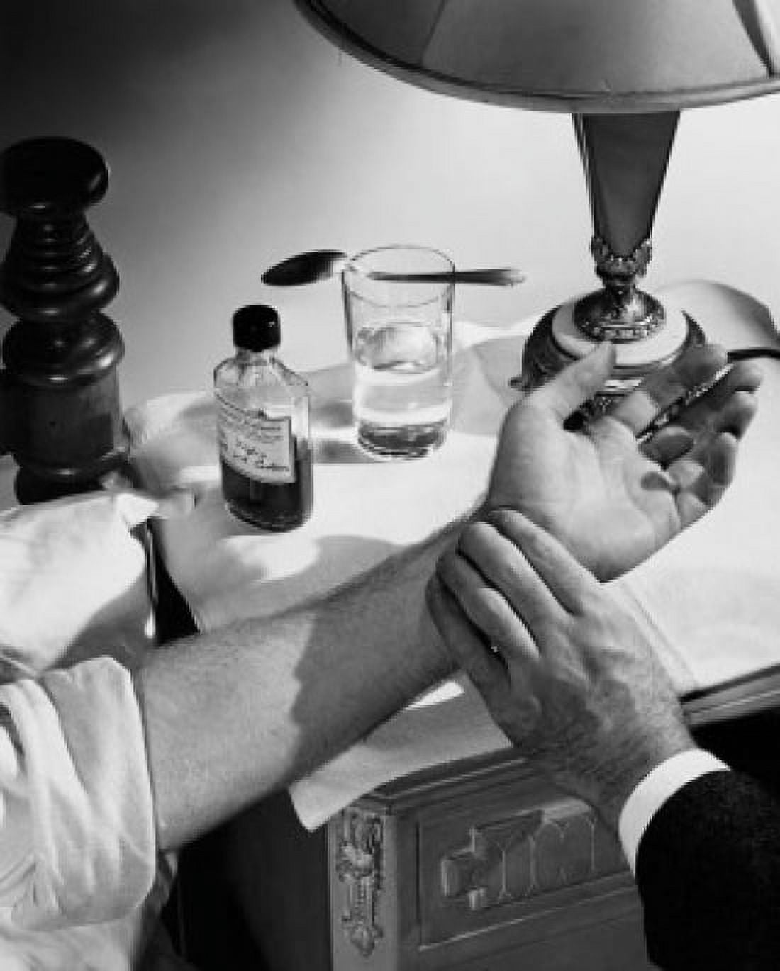 Close-up of a male doctors hand checking a patients pulse Canvas Art - (24 x 36)