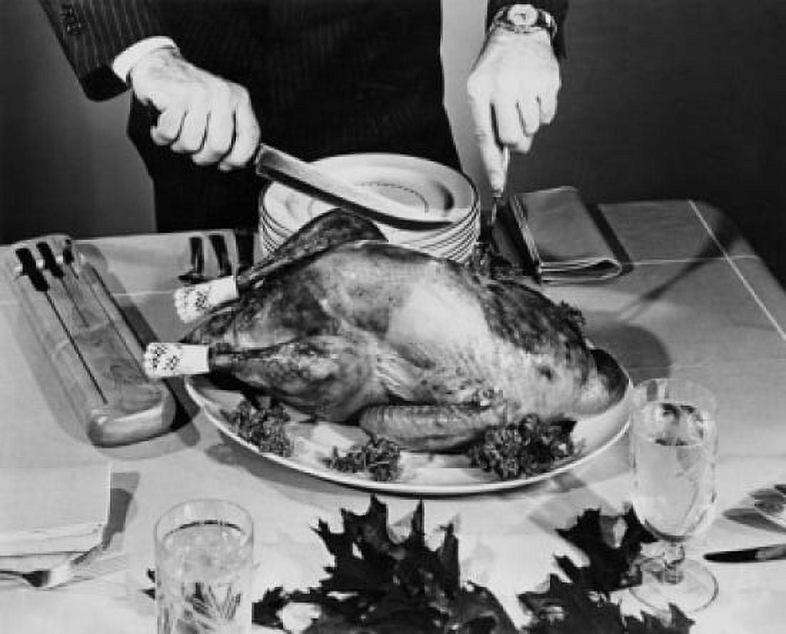 Close-up of a man cutting a roasted turkey on Thanksgiving day Canvas Art - (18 x 24)