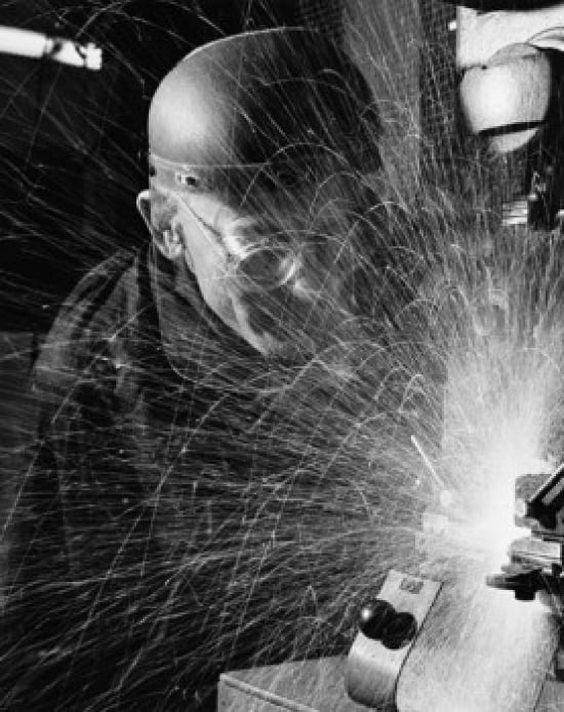 Close-up of a man cutting metal in a factory Canvas Art - (24 x 36)