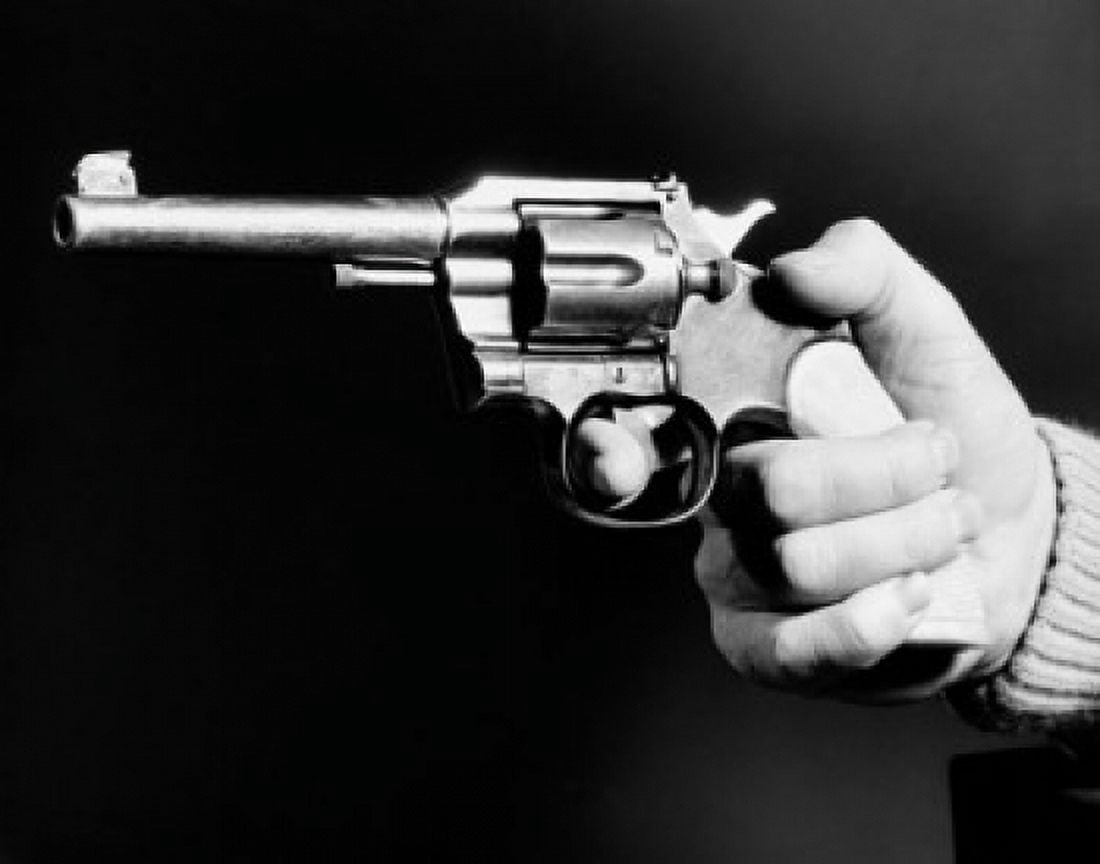 Close-up of a mans hand holding a revolver Canvas Art - (18 x 24)