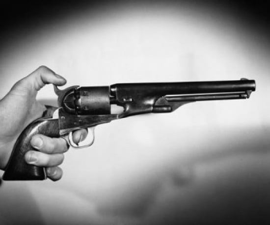 Close-up of a mans hand holding a revolver Canvas Art - (18 x 24)