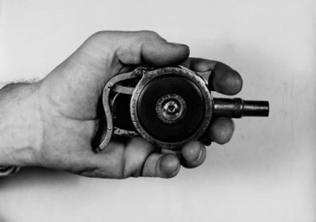 Close-up of a mans hand holding a squeezer pistol Canvas Art - (18 x 24)
