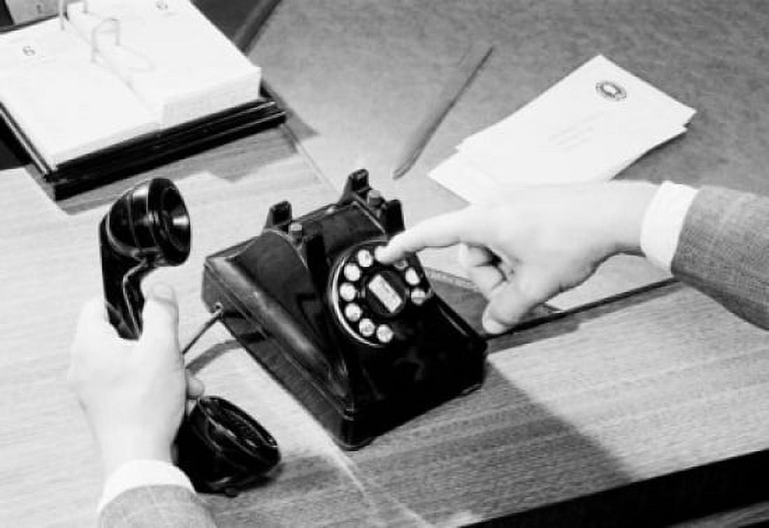 Close-up of a mans hands dialing a number on a rotary phone Canvas Art - (18 x 24)