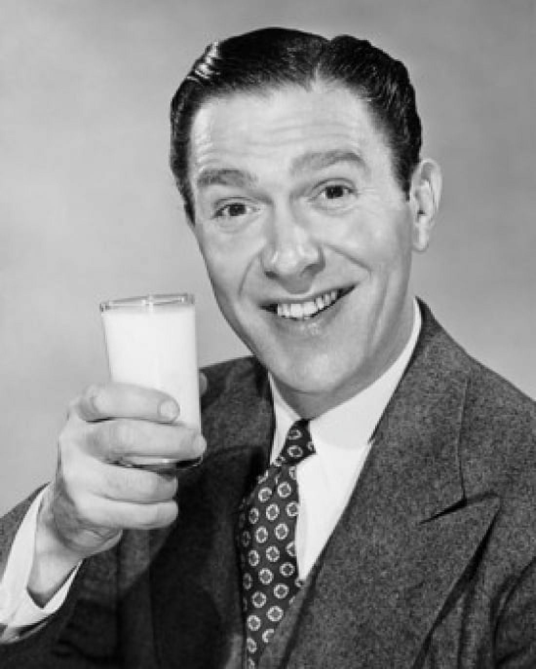 Close-up of a mature man holding a glass of milk Canvas Art - (24 x 36)