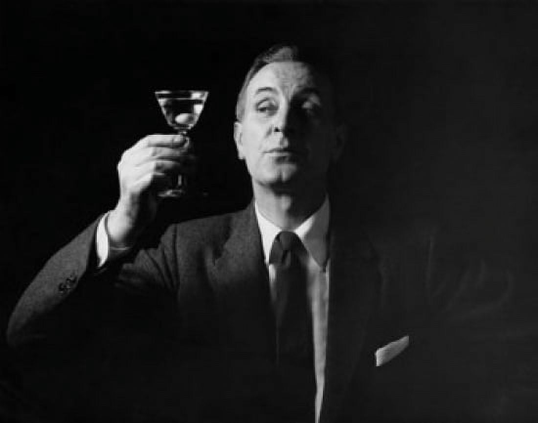 Close-up of a mature man holding a martini Canvas Art - (18 x 24)
