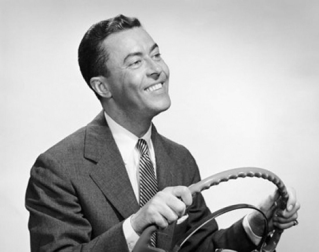 Close-up of a mature man holding the steering wheel of a car and smiling Canvas Art - (18 x 24)