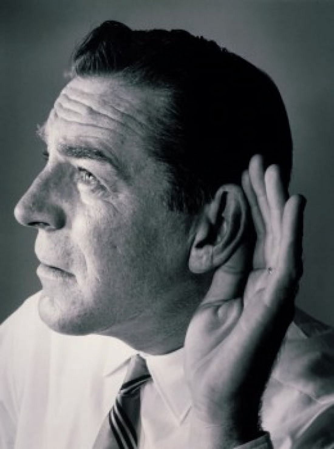Close-up of a mature man with a cupped hand to his ear Canvas Art - (18 x 24)