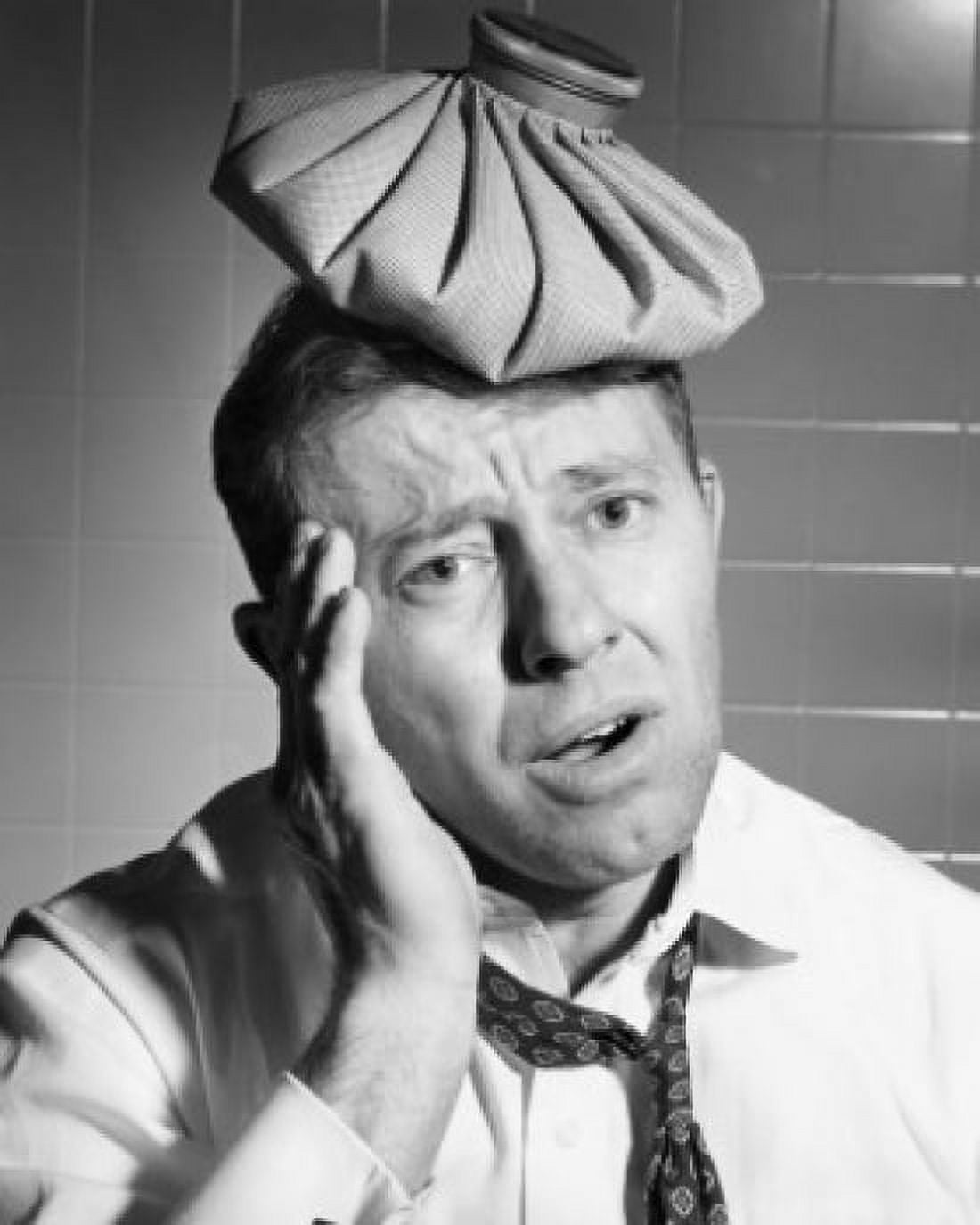 Close-up of a mature man with an ice pack on his head suffering from a headache Canvas Art - (18 x 24)