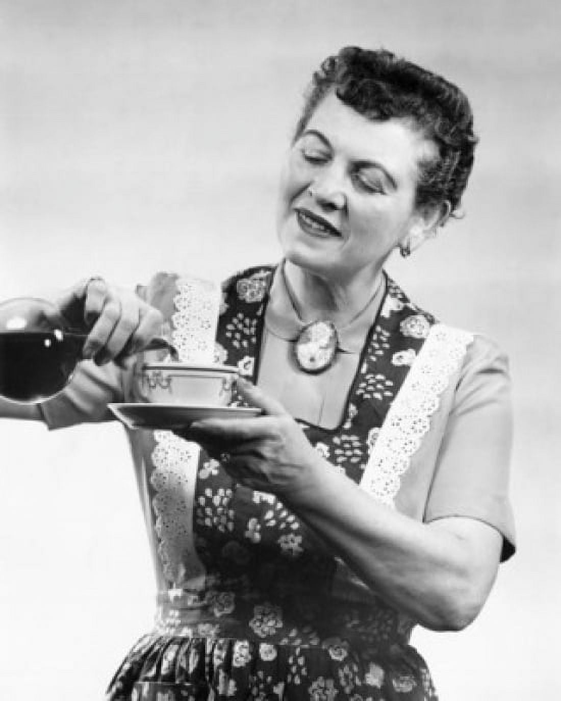 Close-up of a mature woman pouring tea into a cup Canvas Art - (18 x 24)