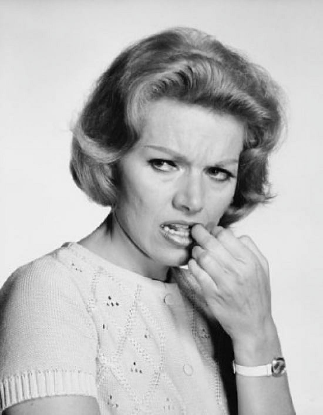 Close-up of a mature woman with her finger in her mouth Canvas Art - (18 x 24)