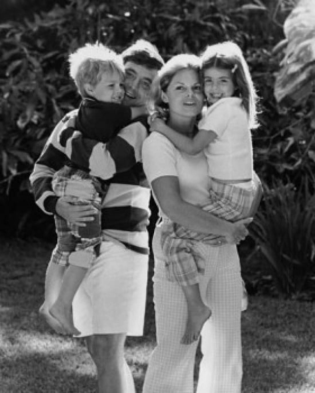 Close-up of a mid adult couple carrying their son and daughter Canvas Art - (18 x 24)