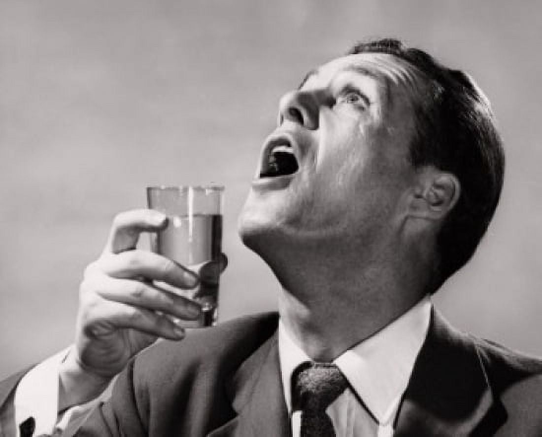 Close-up of a mid adult man gargling Canvas Art - (24 x 36)