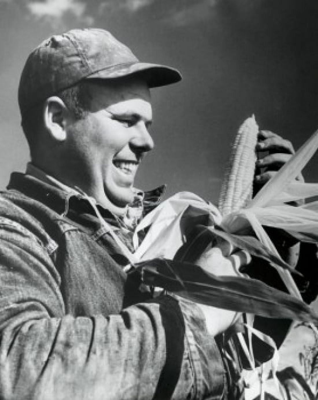 Close-up of a mid adult man holding a corn on the cob Canvas Art - (18 x 24)