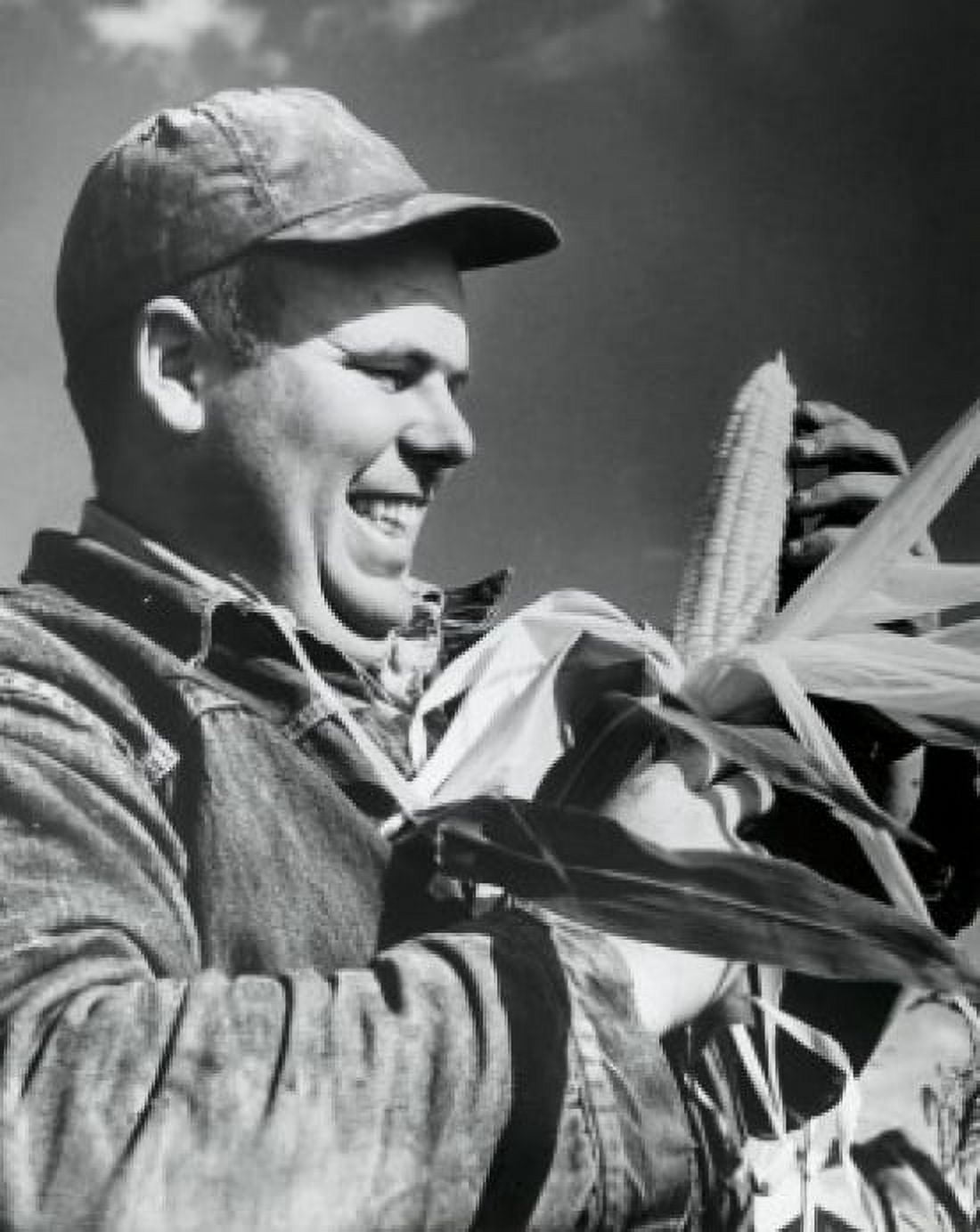Close-up of a mid adult man holding a corn on the cob Canvas Art - (24 x 36)