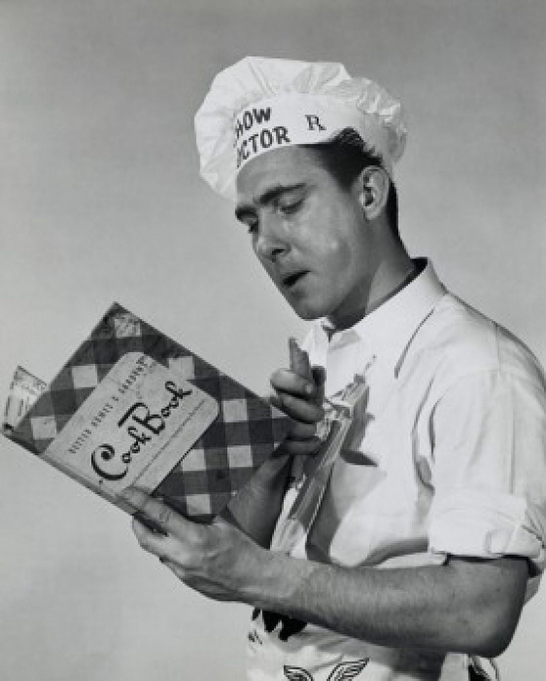 Close-up of a mid adult man reading a cookbook Canvas Art - (18 x 24)