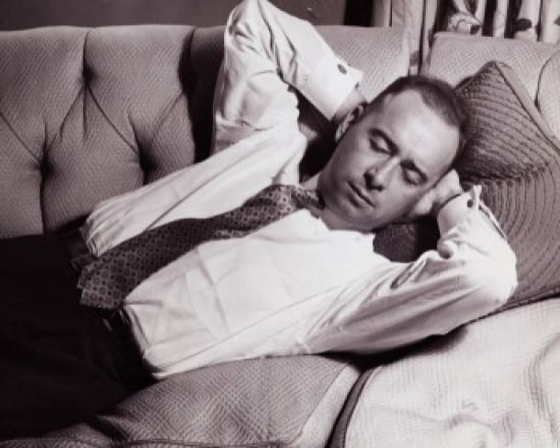Close-up of a mid adult man sleeping on a couch Canvas Art - (24 x 36)
