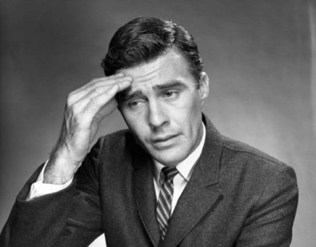 Close-up of a mid adult man suffering from a headache Canvas Art - (18 x 24)
