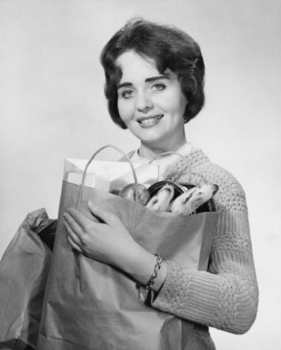 Close-up of a mid adult woman carrying groceries Canvas Art - (18 x 24)