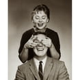 thumbnail image 1 of Close-up of a mid adult woman covering a mid adult man's eyes Poster Print (18 x 24), 1 of 4