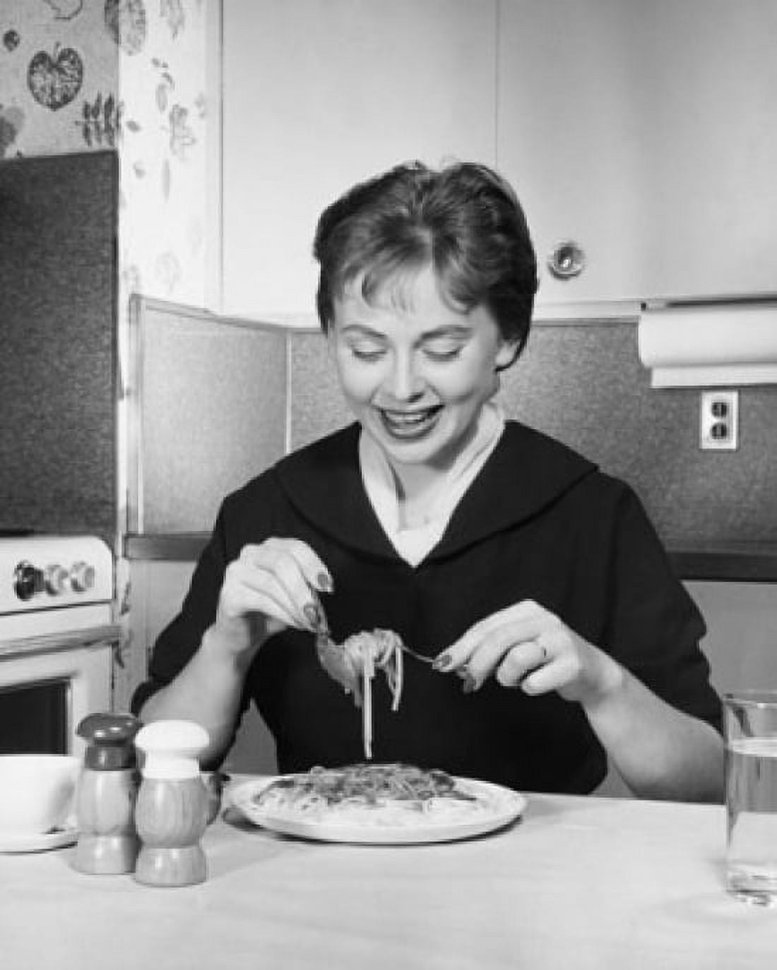 Close-up of a mid adult woman eating pasta Canvas Art - (24 x 36)