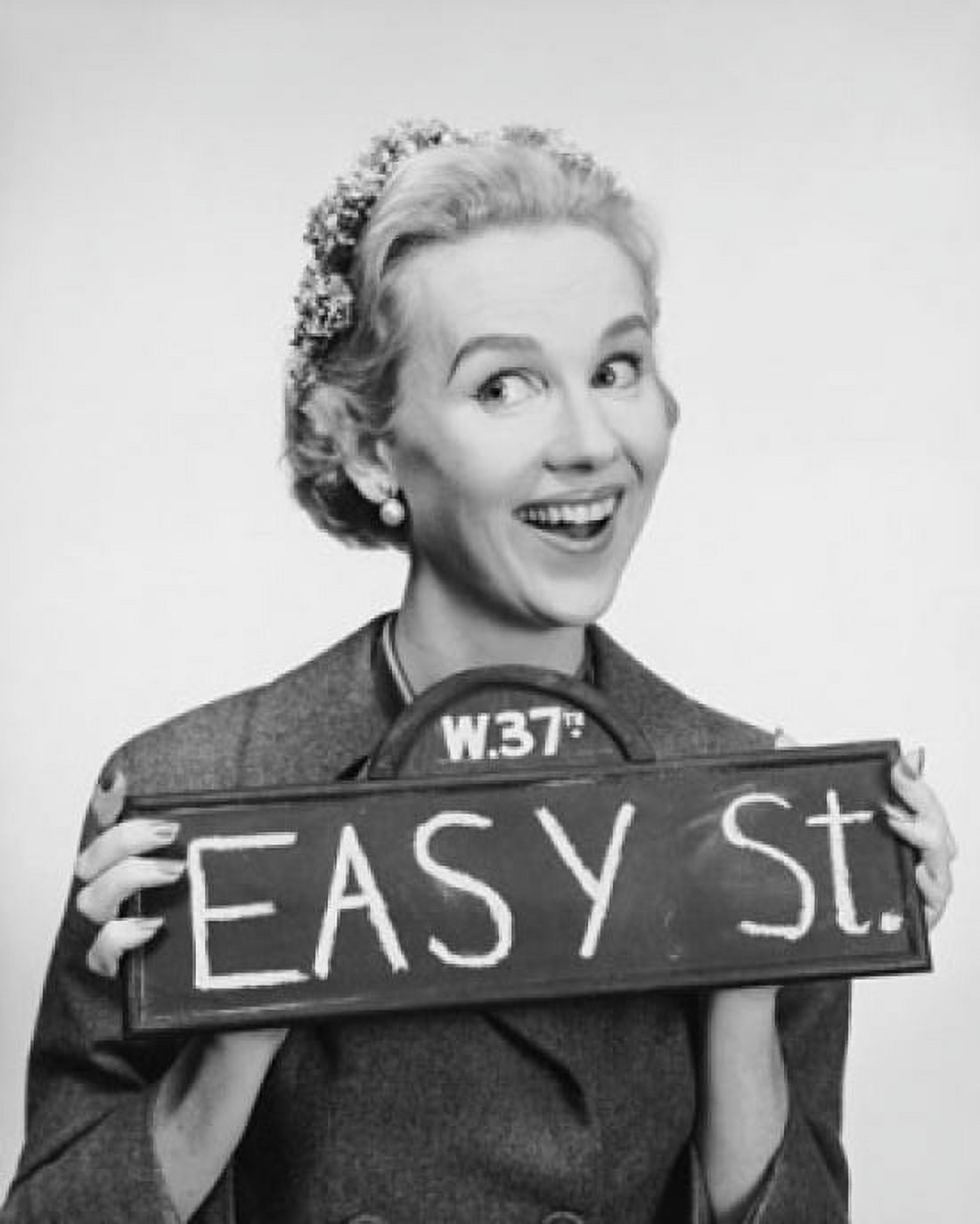 Close-up of a mid adult woman holding a street name sign Canvas Art - (24 x 36)