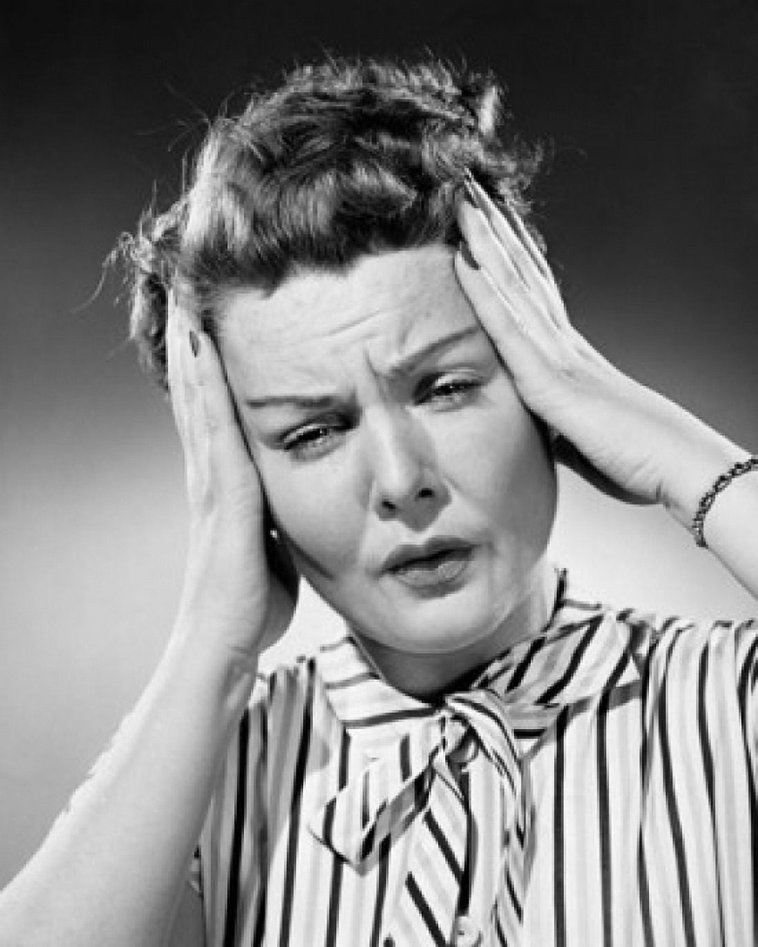 Close-up of a mid adult woman suffering from a headache Canvas Art - (24 x 36)