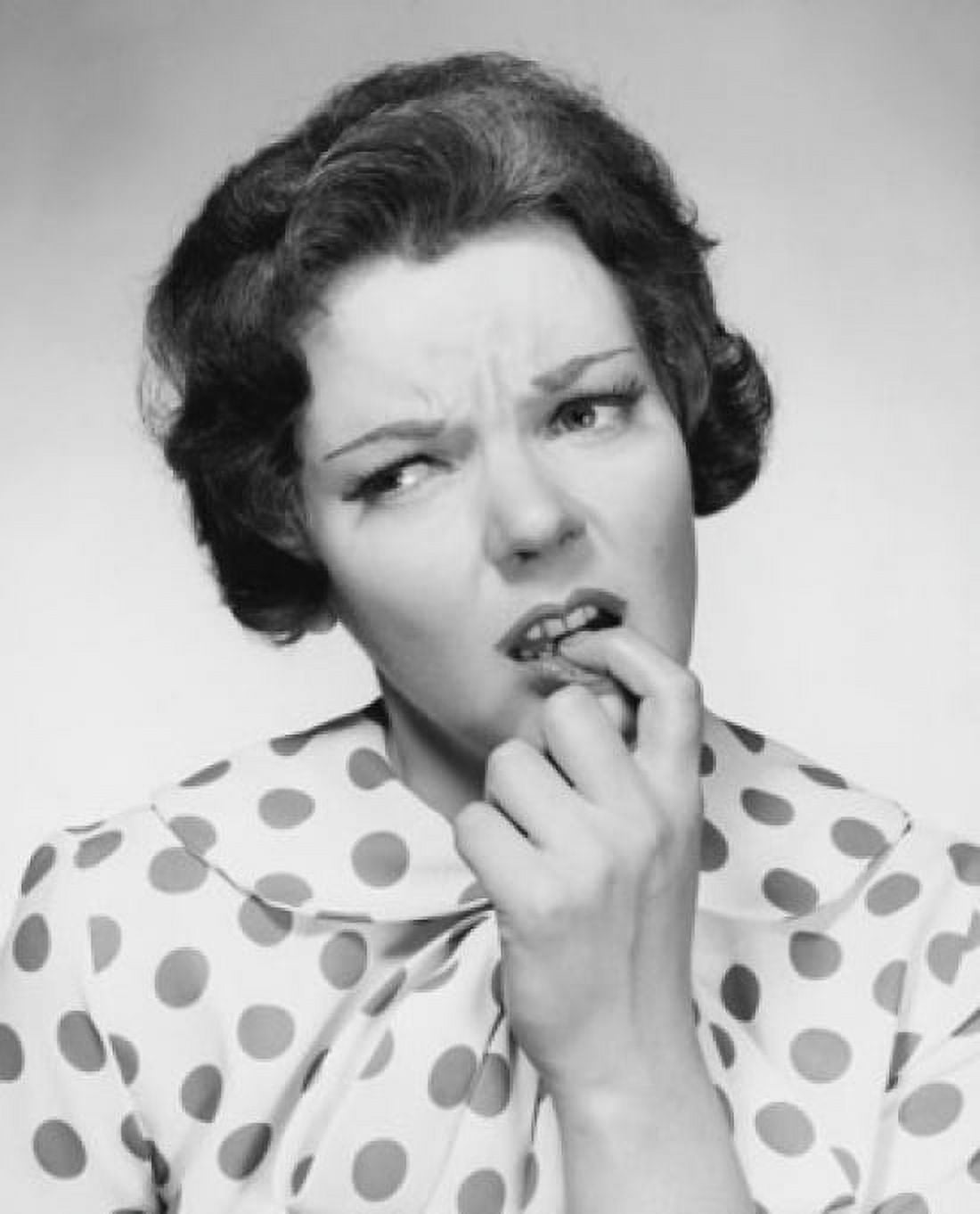 Close-up of a mid adult woman with her finger in her mouth Canvas Art - (18 x 24)